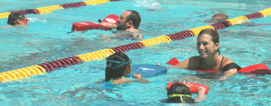 Ken Mignosa Macon Dickson kids' tri 2009: volunteers swim with children at a kids' traithlon