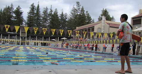 Michael Arenas guarding triathlon: lifeguard at end of olympic sized pool during triathlon