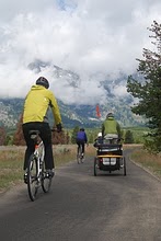 NPS photo biking multi-use path: various cyclists on pathway with mountains in background
