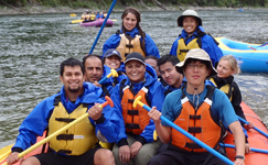 OutdoorClubgroupphoto2011raft 150 pixels: white water rafters, some with their paddles