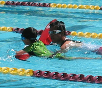 QUANG AND SWIMMER 2010: lifeguard Quang with swimmer at triathlon photo by Alan Ahlstrand