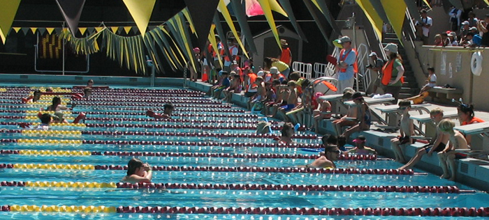 SVKTswimmers 6 & under and lifeguards 2010: 6 years old & under swimmers at triathlon getting into pool as and lifeguards wait in the water photo by Alan Ahlstrand