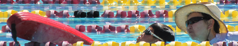 Sherry Fong assists swimmer at Silicon Valley Kids triathlon: 