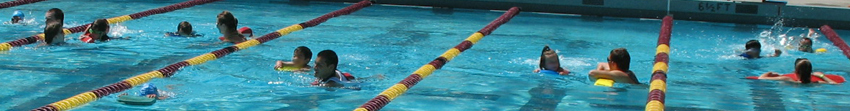 SiliconValleykidstriathlon2010: adult lifesavers swimming with the youngest kids at a triathlon photo by Alan Ahlstrand, lifeguard instructor and volunteer of record for De Anza College