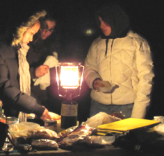 Tracey, Kritti and Kelly making dinner: three girls making dinner on a camping trip