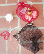bags for pool toys made from net bags for fruit: two net bags with twine as drawstrings