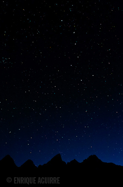 big dipper over the Tetons photo by Enrique Aguirre: mountains with lots of stars above, including the big dipper