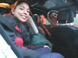 carpool 2009 winter 225 pixels: three people stuffed in a car with gear