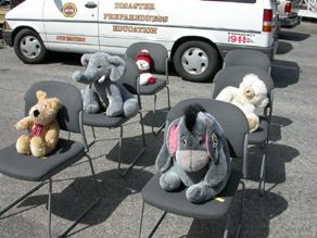 CERT triage animals: stuffed animals sit on chairs in rows representing a bus load of victims