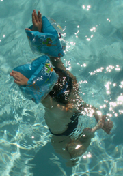 child held under by waterwings: 