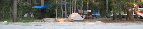 leave no trace don't widen campsite: a campsite with a tent pitched out of bounds in a tiny meadow