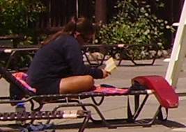 lifeguard reading a book while on duty: lifeguard reading a book while on duty