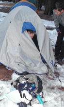 pack was dragged out of tent last night: a camper looking out of his tent to find that his daypack was dragged out of his tent that night by a raccoon