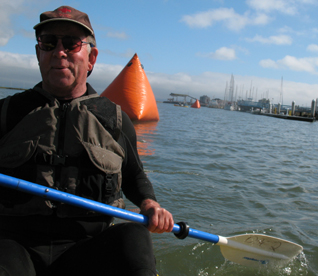 2009 Senior Games lifeguard Alan Ahlstrand: 2009 Senior Games lifeguard Alan Ahlstrand tows a race buoy to the finish