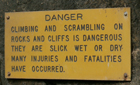 sign danger climbing on rocks: 