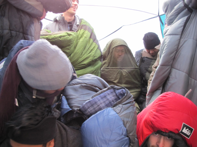 starting to form the pile of people in tent 2010: starting to form the pile of people in tent, a few lying down, most standing in their sleeping bags