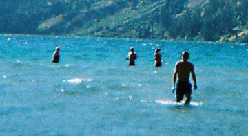 swimming Leigh lake 2008 by mark nevill: four people swimming, well in this picture standing, in Leigh lake 2008. Photo by mark nevill.
