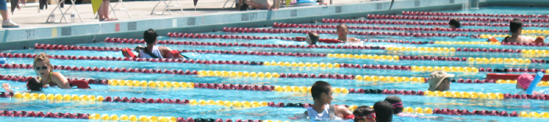 under six many lanes 2010: lifeguards swimming with kids at triathlon photo by Alan Ahlstrand