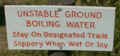 yellowstone warning sign unstable ground stay on trail: 