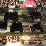 rows of various flavors of chocolate truffles