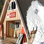 steep roofed building in the snow