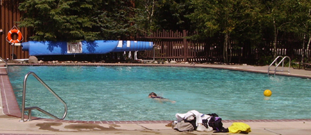 swimming pool with one person swimming
