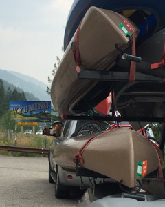 kayaks on trailer , Bullwinkle trip mascot and Wyoming Welcome sign