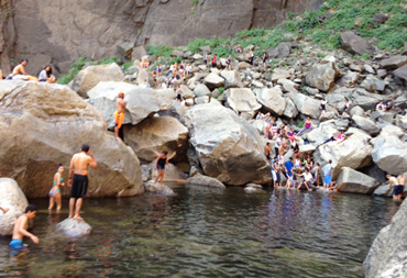 crowd of people near or in a river