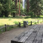 picnic table in foreground, Yosemite Falls in background