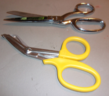 two pairs of scissors, one with pointed ends and one with blunt ends