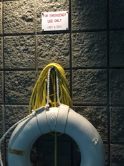 ring buoy with sign emergency use only not a toy
