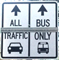 sign designating one lane for all traffic and one lane for bus only