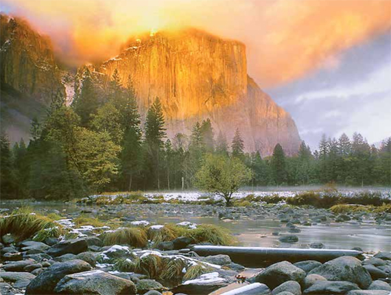 NPS photo sunset color on El Capitan with river in foreground