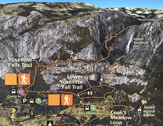 Yosemite color aerial photos with trails marked at display in front of Yosemite Exploration Center Mary Donahue