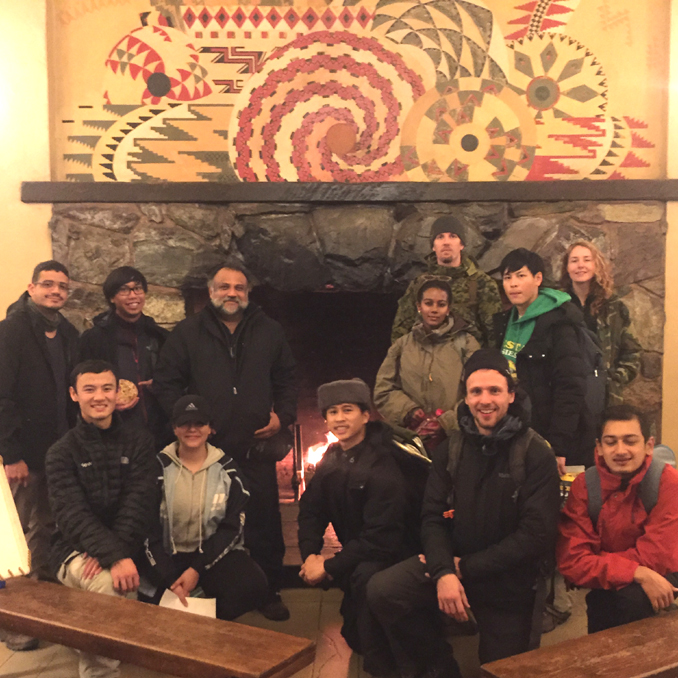 group photo in front of fireplace