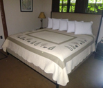 large bed with 5 pillows