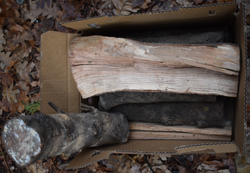 a purchased box of firewood in various sizes