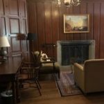paneled room with fireplace