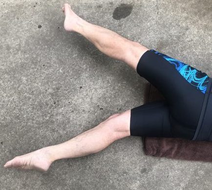 legs spread apart in a V position