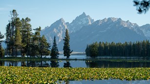 lake with mountains farther away