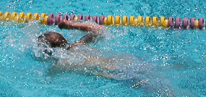 swimmer with arm barely out of water