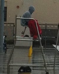 lifeguard in stand with feet showing on rescue tube