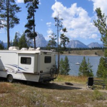 motor home and lake behind it