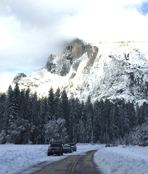 car blocking roadway partially full of snow