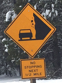 Yosemite road sign no stoping along stretch of road with rockfall common