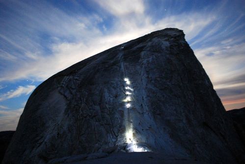 people with headlamps going up the side of Half Dome