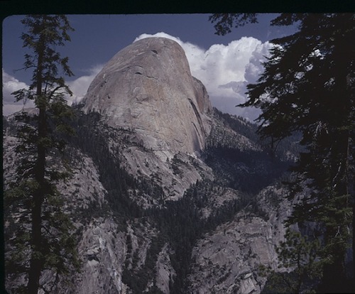 half dome with clouds behind