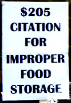 sign says $205 citation for improper food storage