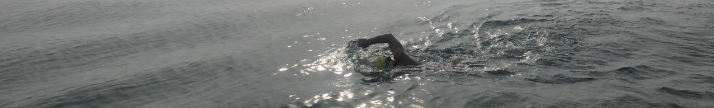 man swimming in the ocean