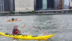 swimmer and kayaker in river